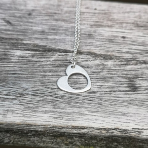 Hollow heart pendant set in sterling silver