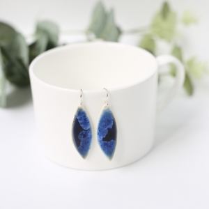 White porcelain leaf shaped earrings  with blue crystalline glaze